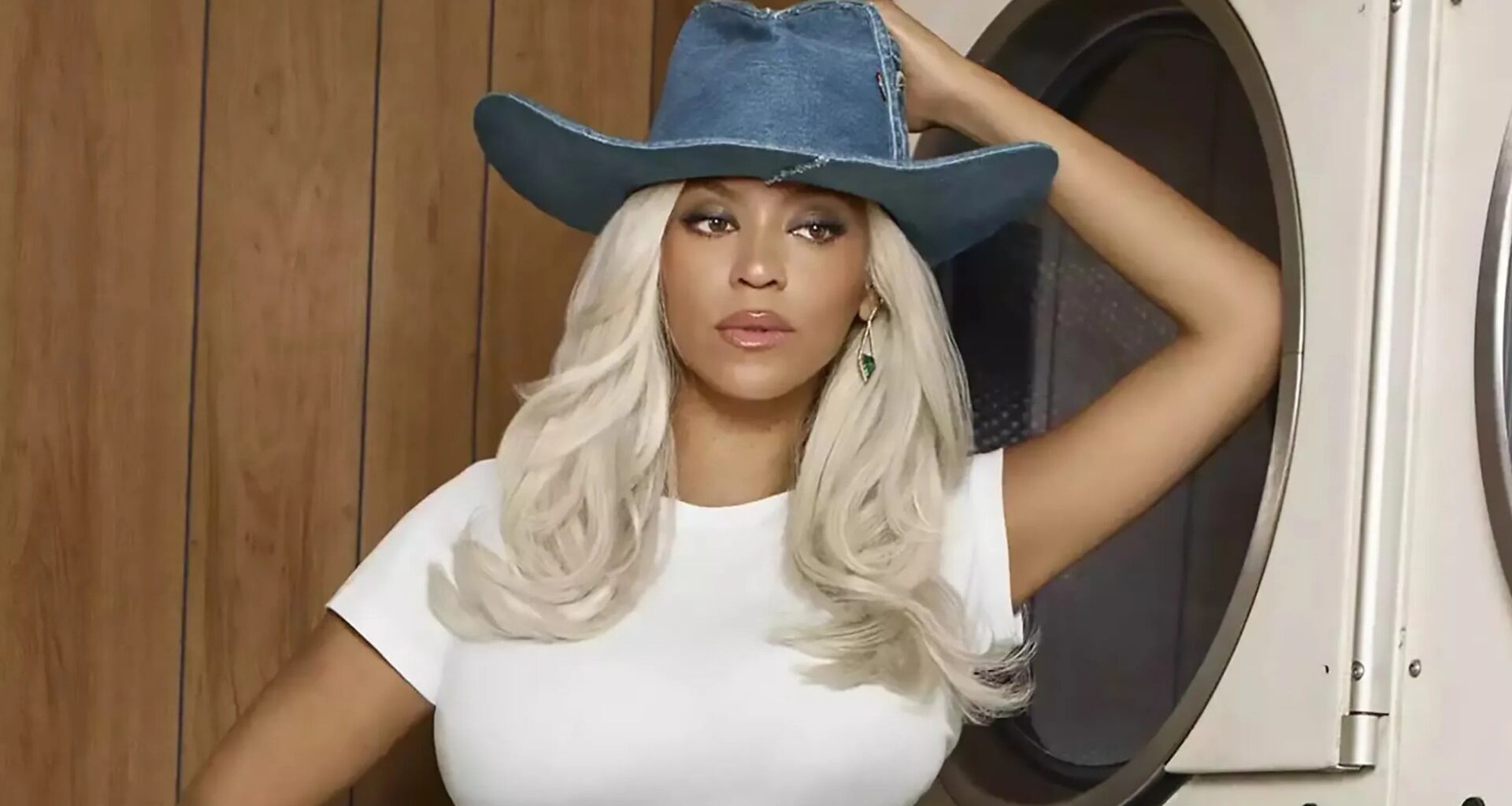 Watch Beyonce strip off to her underwear as she recreate iconic Levis launderette ad