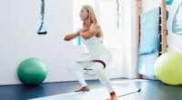 middle-aged woman resistance band workout