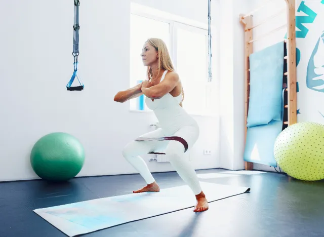 middle-aged woman resistance band workout