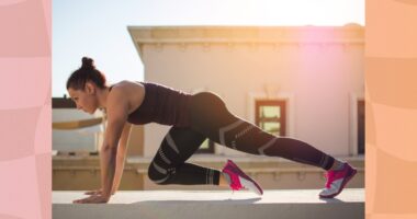 fit, focused brunette woman doing mountain climber exercise outdoors