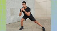 fit, focused man doing lateral lunge outdoors