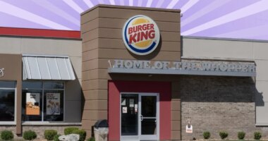 Burger King exterior on striped purple background