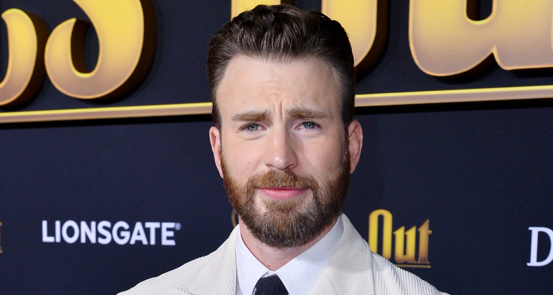 Chris Evans looks so different with long hair and beard at Red One premiere as fans say ‘that’s not Captain America!’