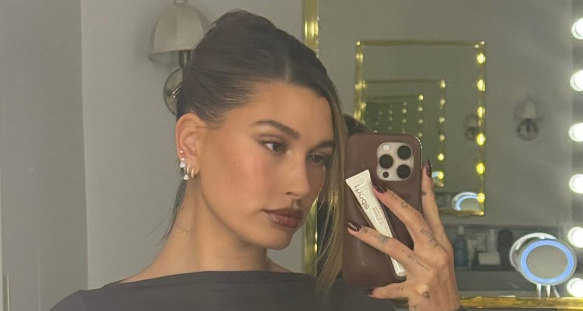 Hailey Bieber shares rare new photo of son Jack Blues wearing a fleece onesie and voting sticker