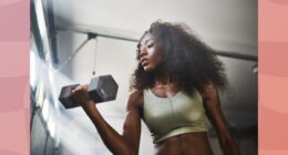 fit woman lifting dumbbells at the gym