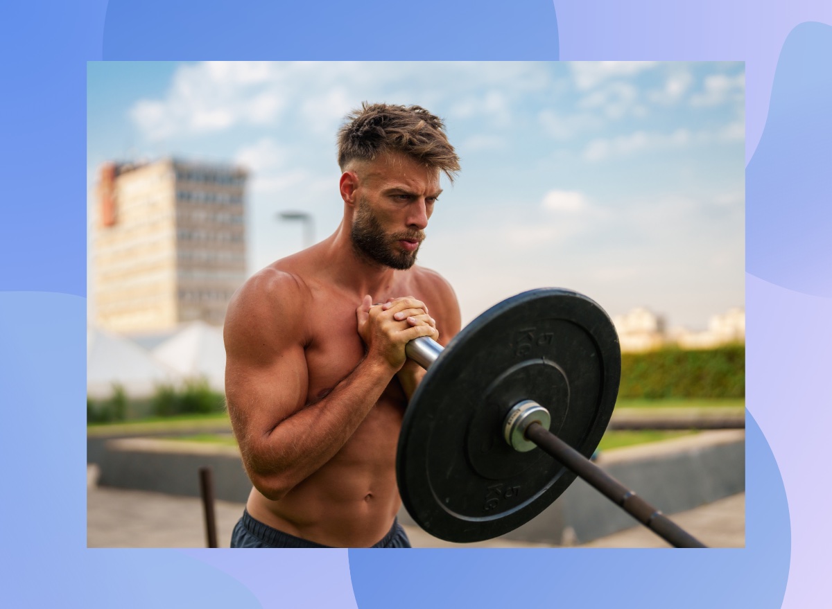 fit, muscular shirtless man lifting barbell at outdoor gym