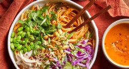 Bowl of pumpkin pad thai with peanuts ready to be eaten