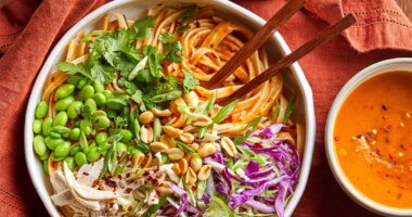 Bowl of pumpkin pad thai with peanuts ready to be eaten