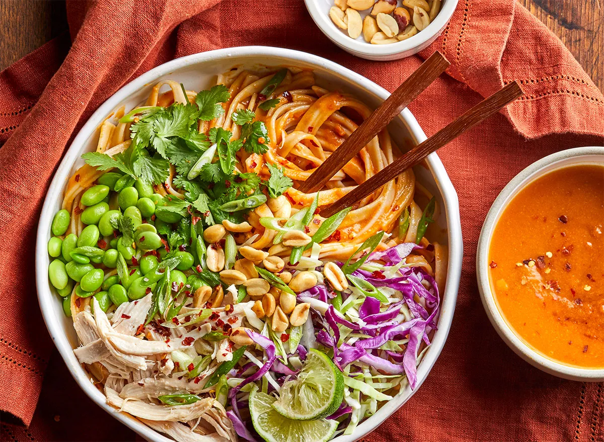 Bowl of pumpkin pad thai with peanuts ready to be eaten