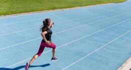 woman sprinting track