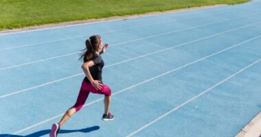 woman sprinting track