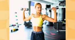 fit blonde woman exercising with dumbbells at the gym