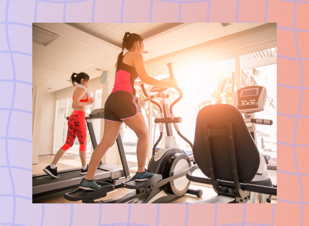 lineup of a treadmill, elliptical, and exercise bike at the gym in front of floor-to-ceiling windows with sun shining through