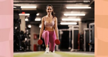 fit brunette woman doing dumbbell lunges at the gym