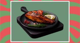 a photo of festive plate of salmon on a designed holiday-themed background