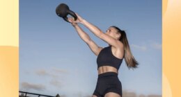 fit woman doing kettlebell swing outdoors at dusk