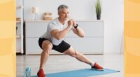 fit, mature man doing side lunges at home on yoga mat in bright living space