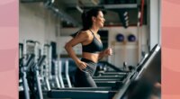 fit, focused brunette woman running on the treadmill at the gym