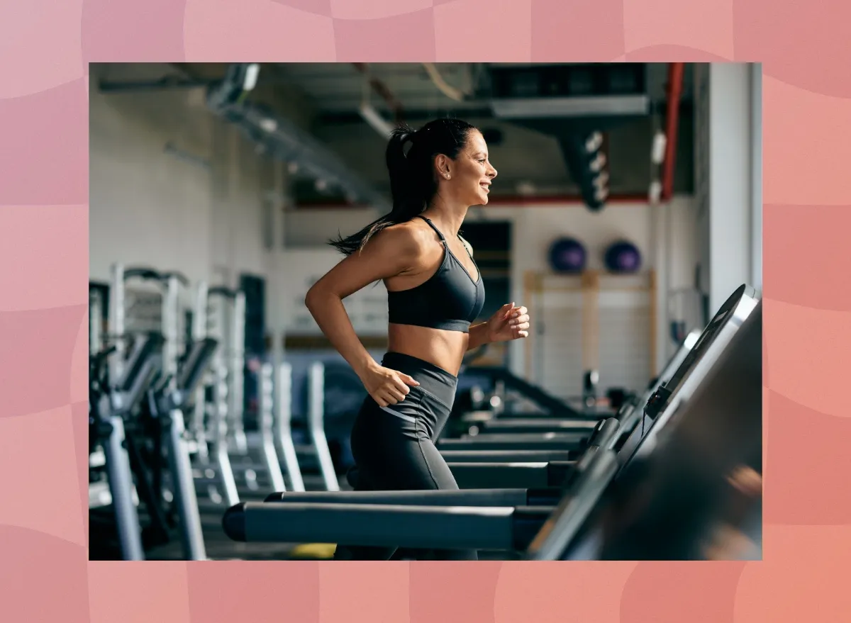 fit, focused brunette woman running on the treadmill at the gym