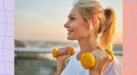 close-up of mature blonde woman walking while lifting dumbbells at sunset