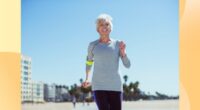 fit, mature woman power walking or jogging on the beach on a sunny day