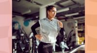 fit brunette woman running on treadmill at the gym