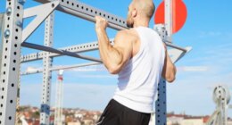 middle-aged man doing pull-ups