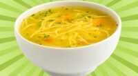 A bowl of chicken noodle soup set against a vibrant background.