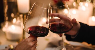 One glass of wine a day could HALVE your risk of a heart attack