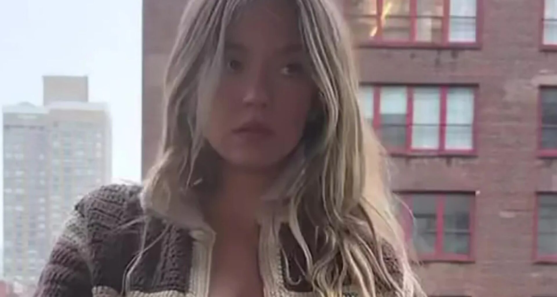 Sydney Sweeney looks stunning as she goes braless on a balcony in New York