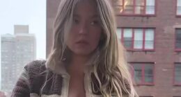 Sydney Sweeney looks stunning as she goes braless on a balcony in New York