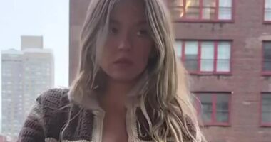 Sydney Sweeney looks stunning as she goes braless on a balcony in New York