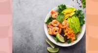 bowl of kale, avocado, lentil, and shrimp salad