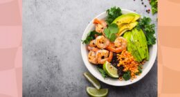 bowl of kale, avocado, lentil, and shrimp salad