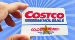 A closeup of a Costco Gold-level membership card set against a vibrant background.