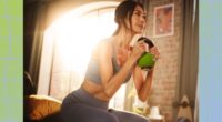 fit woman doing kettlebell goblet squat in bedroom