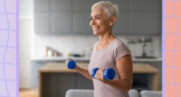 mature, happy woman lifting dumbbells in her living room