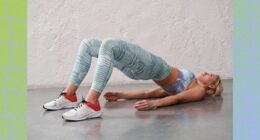 fit blonde woman doing glute bridge exercise