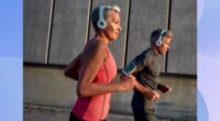 fit, focused mature woman running outdoors