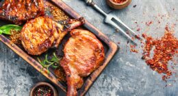 pork chops on cutting board