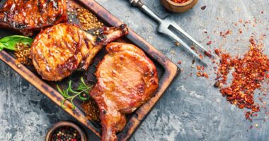 pork chops on cutting board