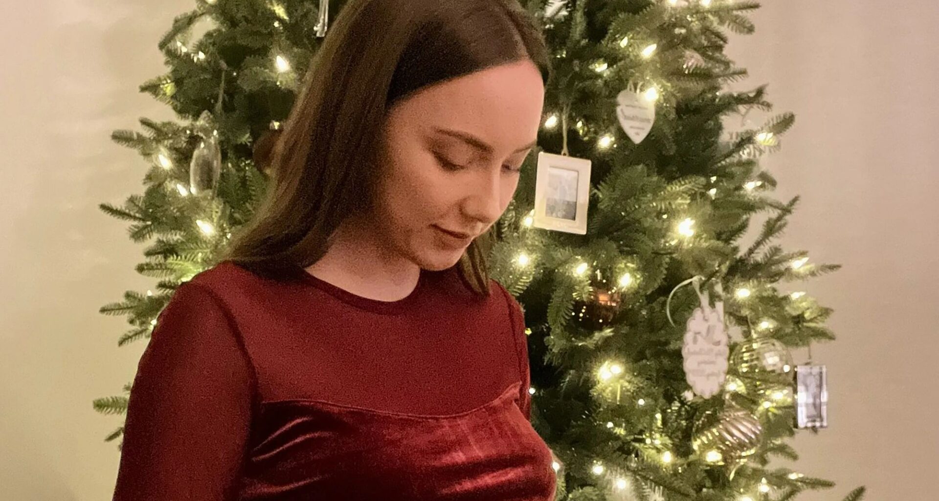 Eminem’s pregnant daughter Hailie Jade shows off her bare baby bump in festive crop top