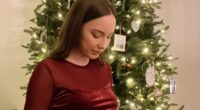 Eminem’s pregnant daughter Hailie Jade shows off her bare baby bump in festive crop top