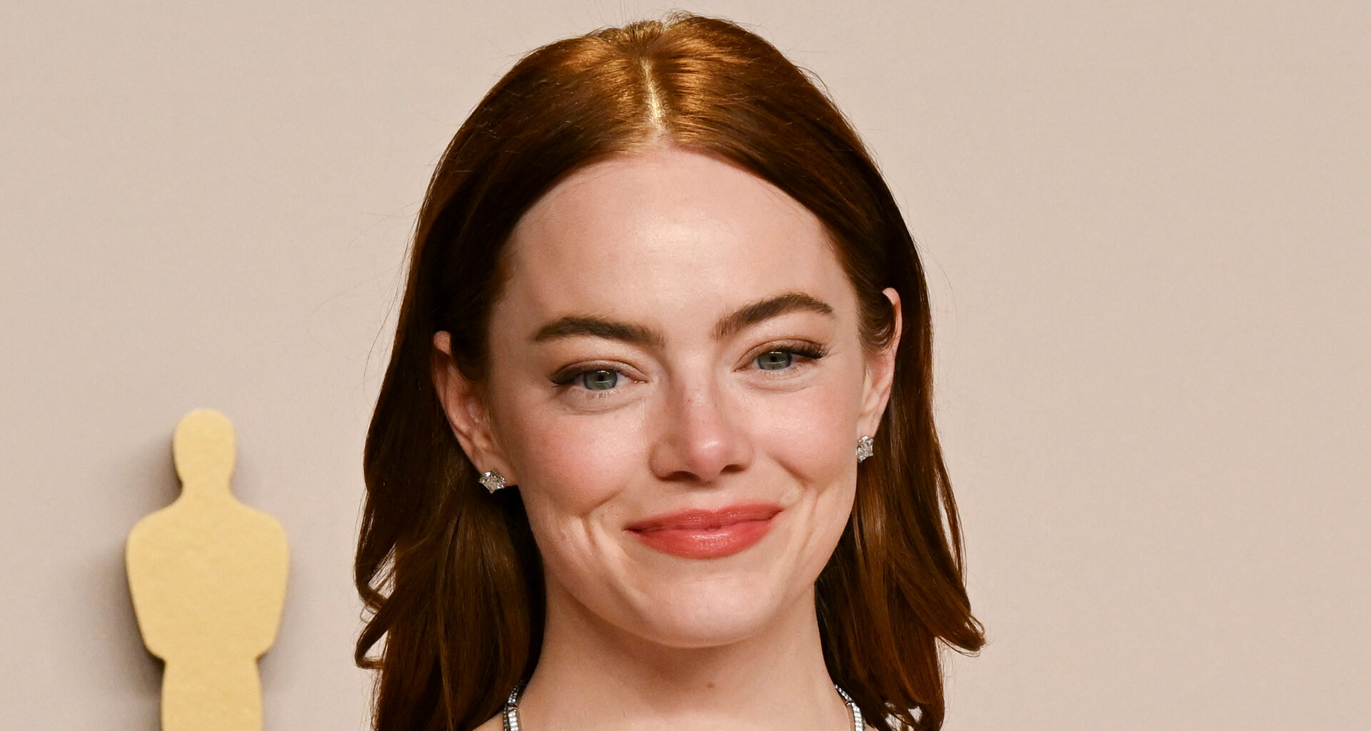 Emma Stone debuts drastic hair transformation on Golden Globes red carpet- and fans are ‘in heaven’ over look