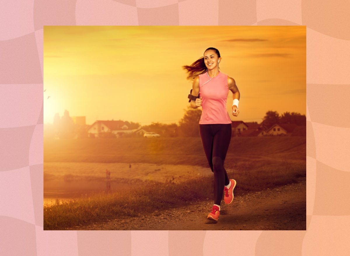 fit, happy woman running outdoors at sunset or sunrise through train in town by the water