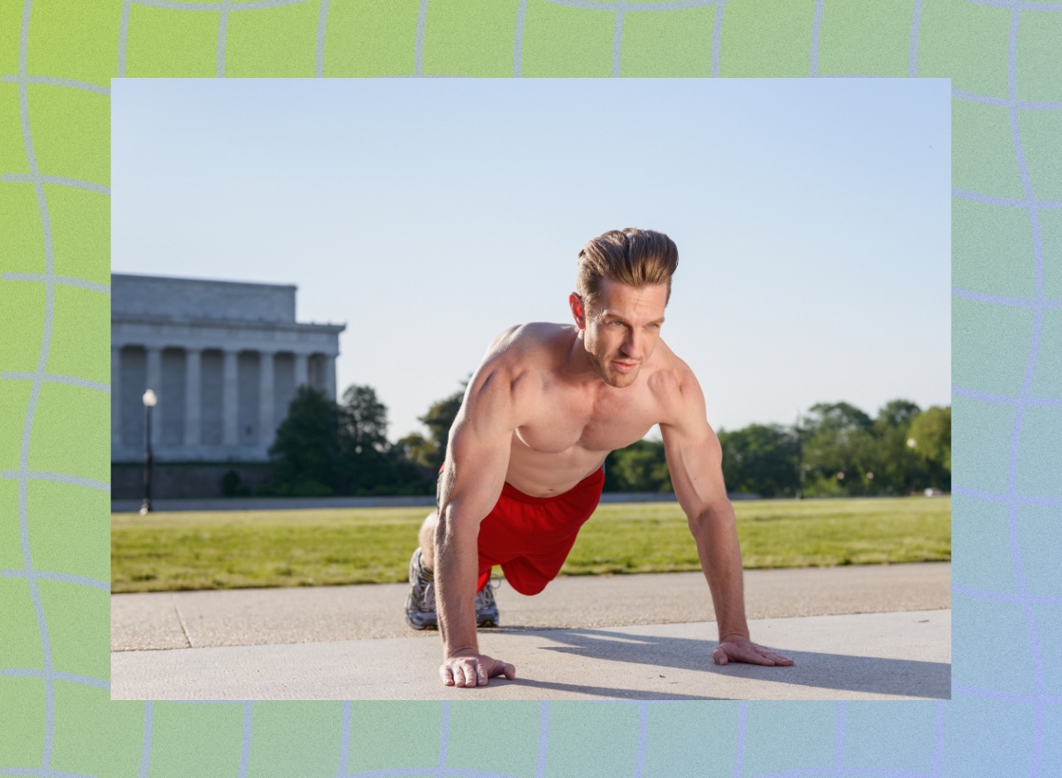 fit, shirtless man doing high plank exercise, gearing up for burpees outdoors on sidewalk