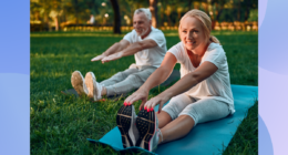 senior couple doing leg stretches on yoga mats in park on sunny day