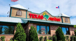 The storefront of a Texas Roadhouse restaurant in Manassas, Va.