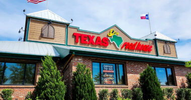 The storefront of a Texas Roadhouse restaurant in Manassas, Va.