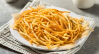 Homemade Shoesttring French Fries with Salt and Ketchup